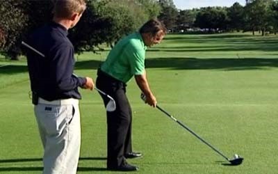 A student learning from Rick's swing